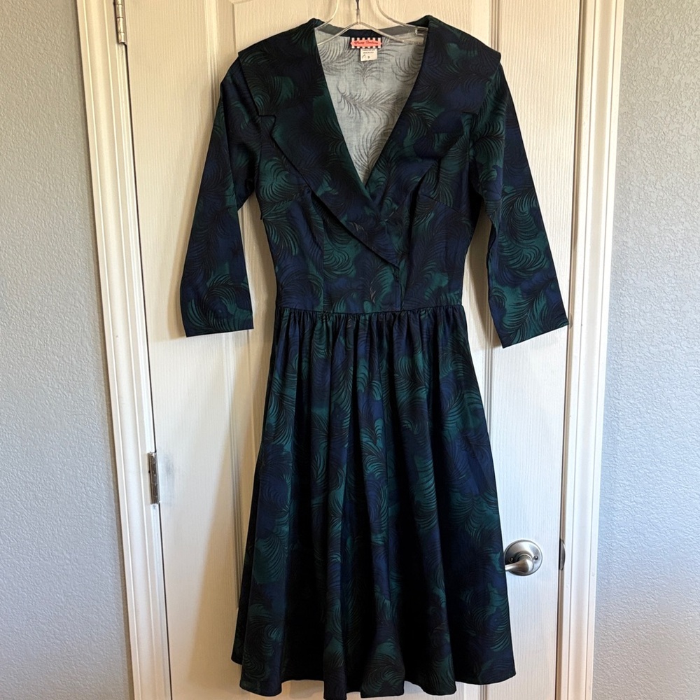 Pinup Couture peacock print swing dress